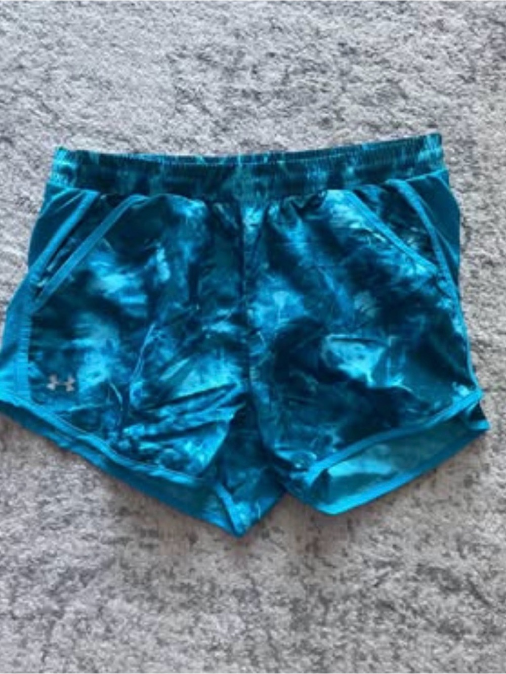 Under Armour blue tie-dye shorts featuring a lightweight fabric